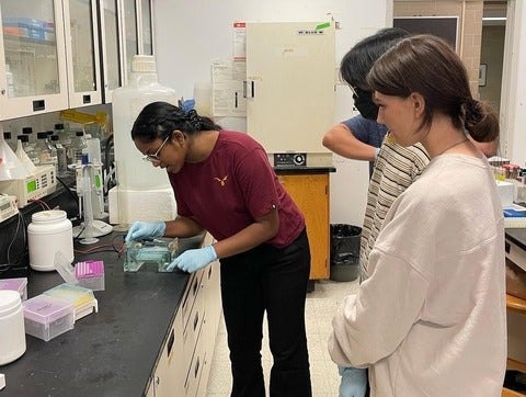 Ria Menon founder of Real Research demonstrating how to use a Petri dish