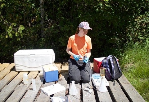 Ellen Cameron collecting water samples