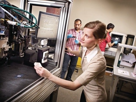 Mihaela Vlasea operating a machine in the MSAM Lab