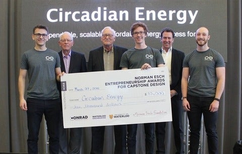 Circadian winners stand smiling with their $10,000 cheque.