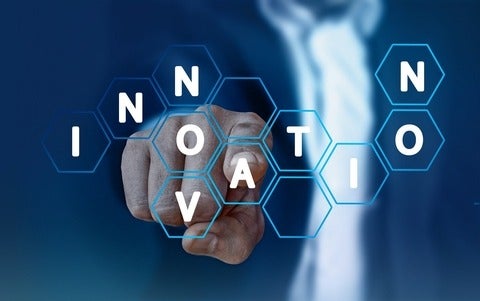 Finger pointing at the word innovation