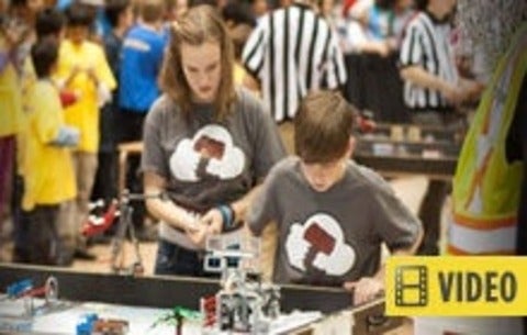 Kids working on small robots