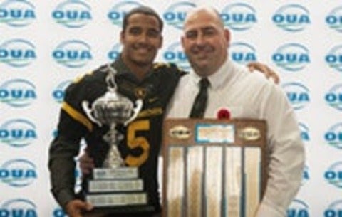 Chris Bertoia and Tre Ford holding awards together