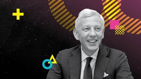 Dominic Barton headshot on a background of neon geometric shapes