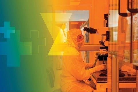 Sarah Odinotski inside the Cleanroom Laboratory wearing full protective gear