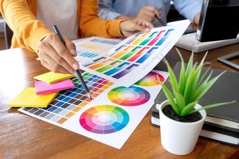 Graphic designers choosing colours to use