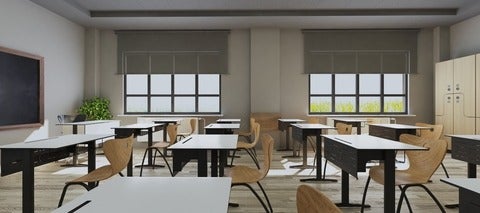 Empty classroom with modern desks, seats and blackboard.