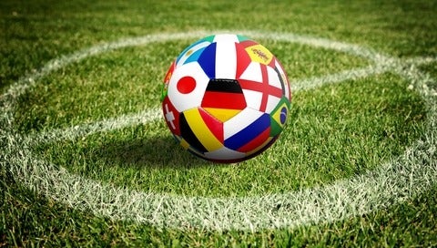 Soccer ball on green playground