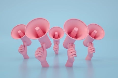 illustration of five hands holding megaphones