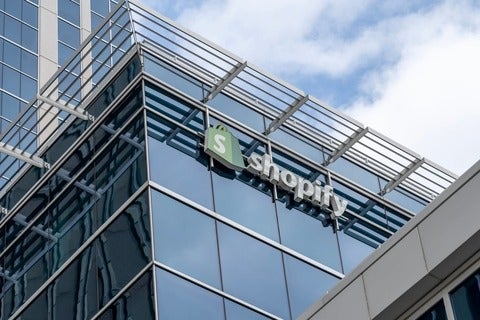 Tall building with Shopify lofo at the top