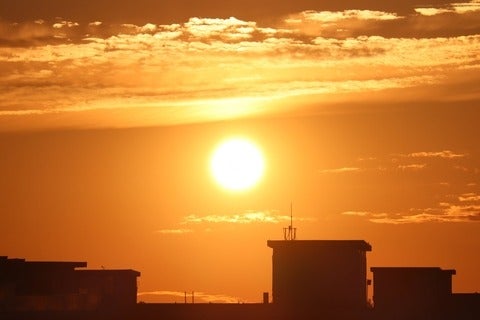 The sun is rising on a hot summer day in Toronto, Canada 