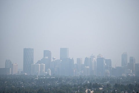 Downtown Calgary city street covered with smoke from forest fires