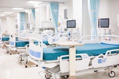 Empty beds in a hospital ward