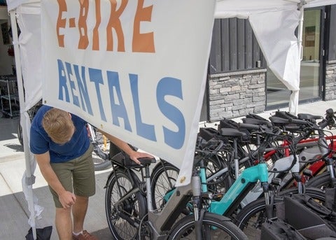 A person picking out an e-mountain bike (Getty Images/AscentXmedia).