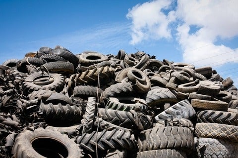A pile or rubber tires in a landfill
