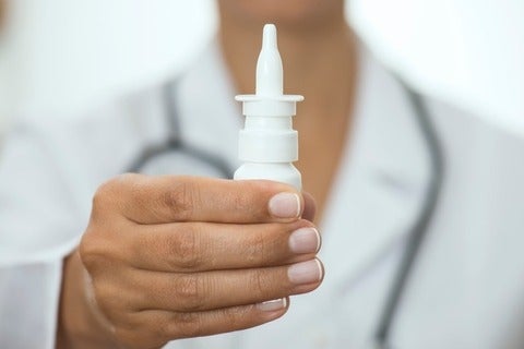Doctor holding nasal spray
