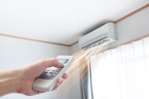 Air conditioner blowing warm air