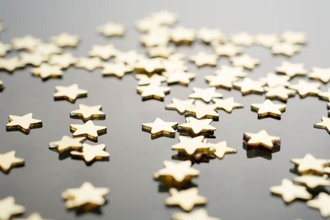 golden stars against grey background