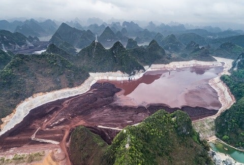 Aerial View of Tailing Ponds in green hill