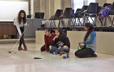 Elementary girls play a game at PhysiX Girls Matter event