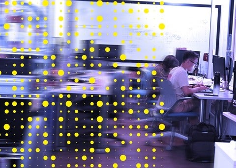 Waterloo students working in a computer lab with an overlay of yellow dots in various sizes