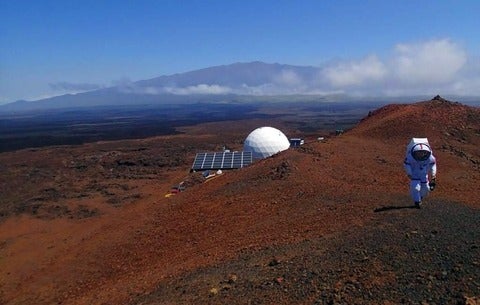 Hawaii Space Exploration Analog and Simulation - Image of astronaut on sandy hills and mountains 