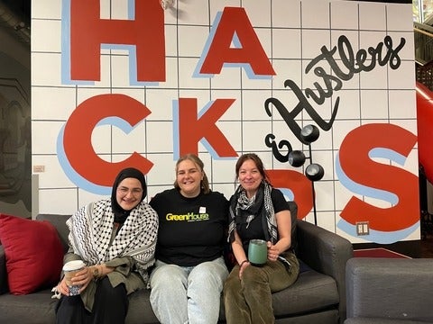 Malak Sameh, Erin Hogan and Lily Viggiano sitting inside the Communitech building