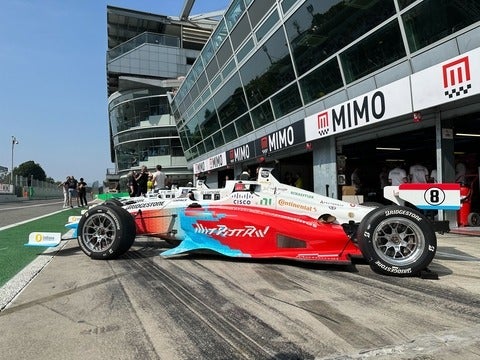 A blue and red race car without a driver's seat