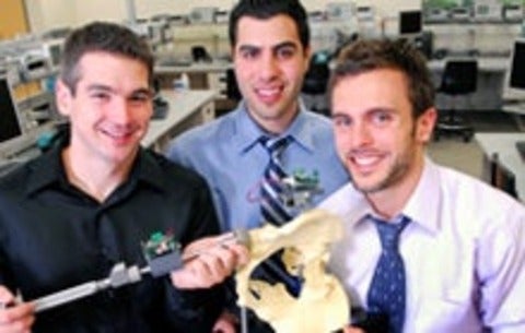 Avenir Medical founders pose with PelvAssist technology