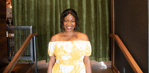 Kemi Amodu in front of stage