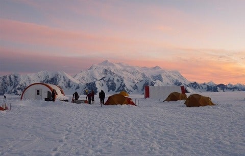A camp in winter at Kluane National Park at sunset