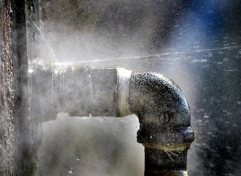 A pipe leaks water.