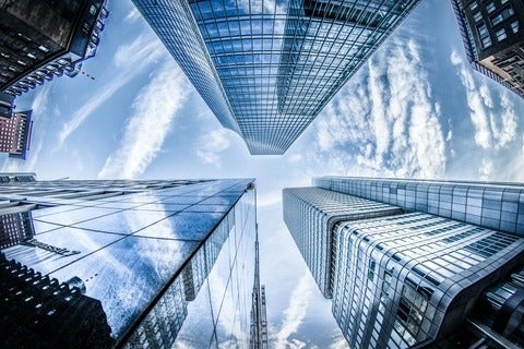 view looking up at high rise buildings