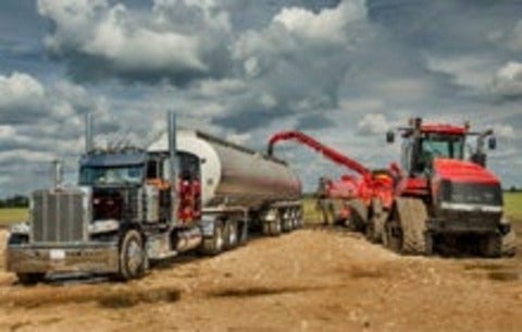 trucks transfering fertilizer