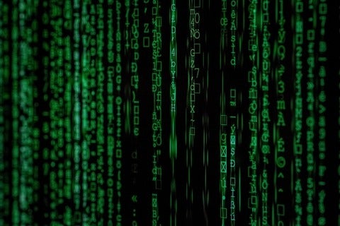 Binary code rushing across screen