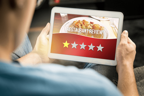 person looking at a restaurant review 
