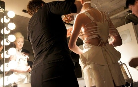 Model in a biomedical cocktail dress
