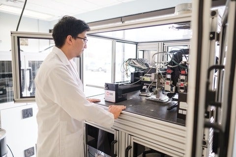 student using a 3-D printer