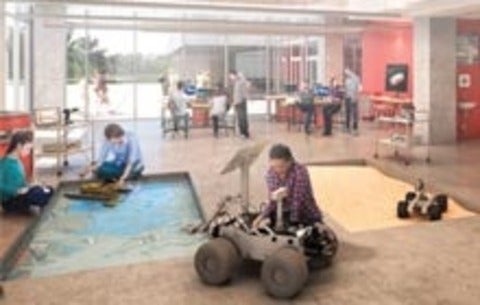 Eng students work with robots 
