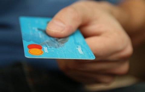 Hand holding a mastercard