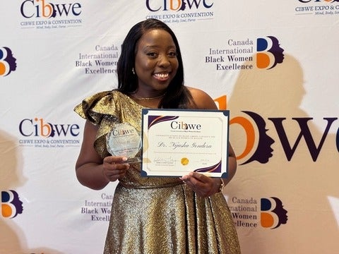 Nyasha Gondora receiving award