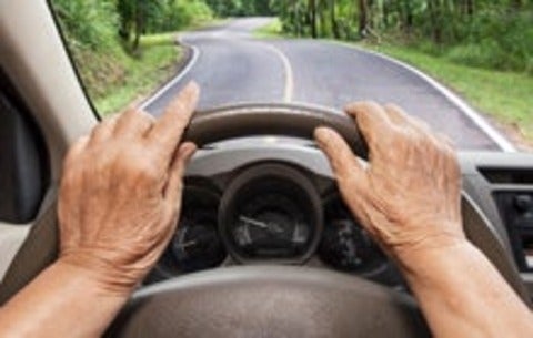 Senior driving a car