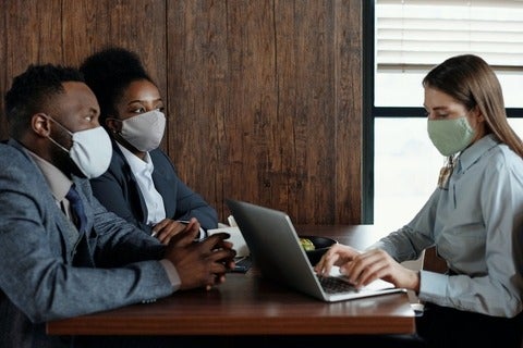 Workers meet with masks on