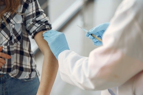 A person getting vaccinated.
