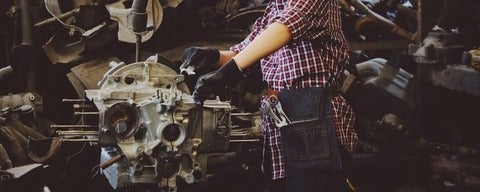 Person working on car engine