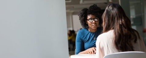 Employer interviewing candidate by Christina Morillo