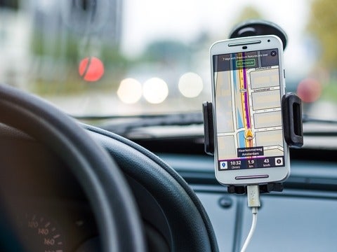 Google map displayed on a cellphone mounted in a car