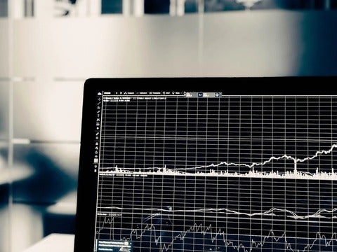 A black computer screen showing a graph of data 