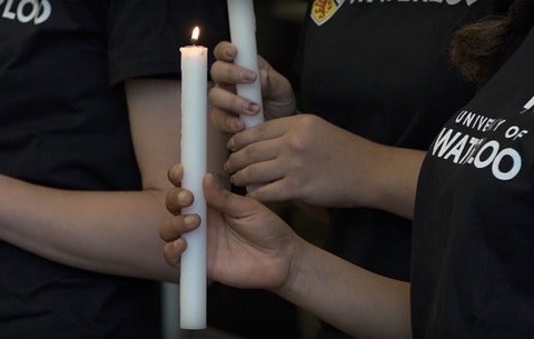 student holding candle
