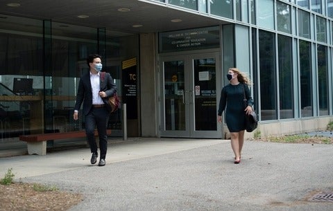 Two students walking outside